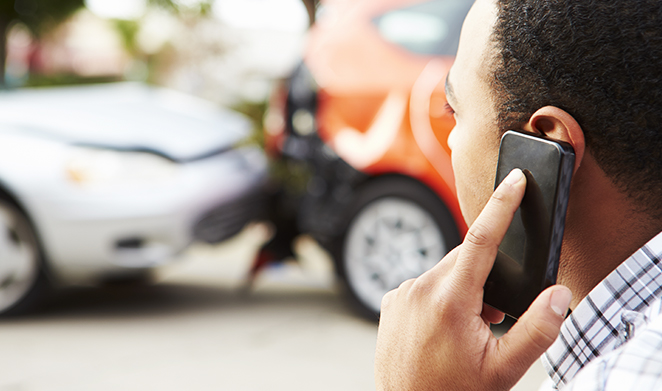man on phone after car accident